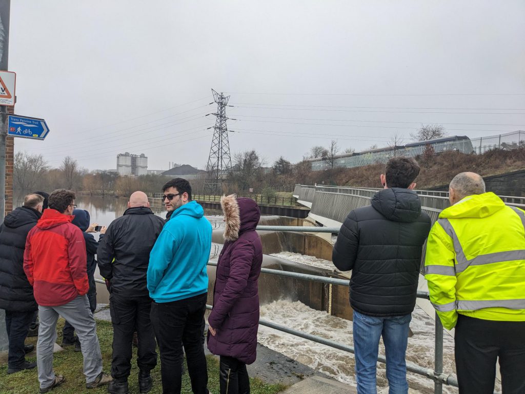 Image shows members of the LRF severe weather sub-group visiting Knostrop Weir on the River Aire.